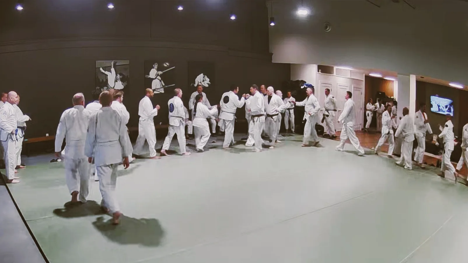 A large Gracie Combatives class lined up in the academy at the end of class.