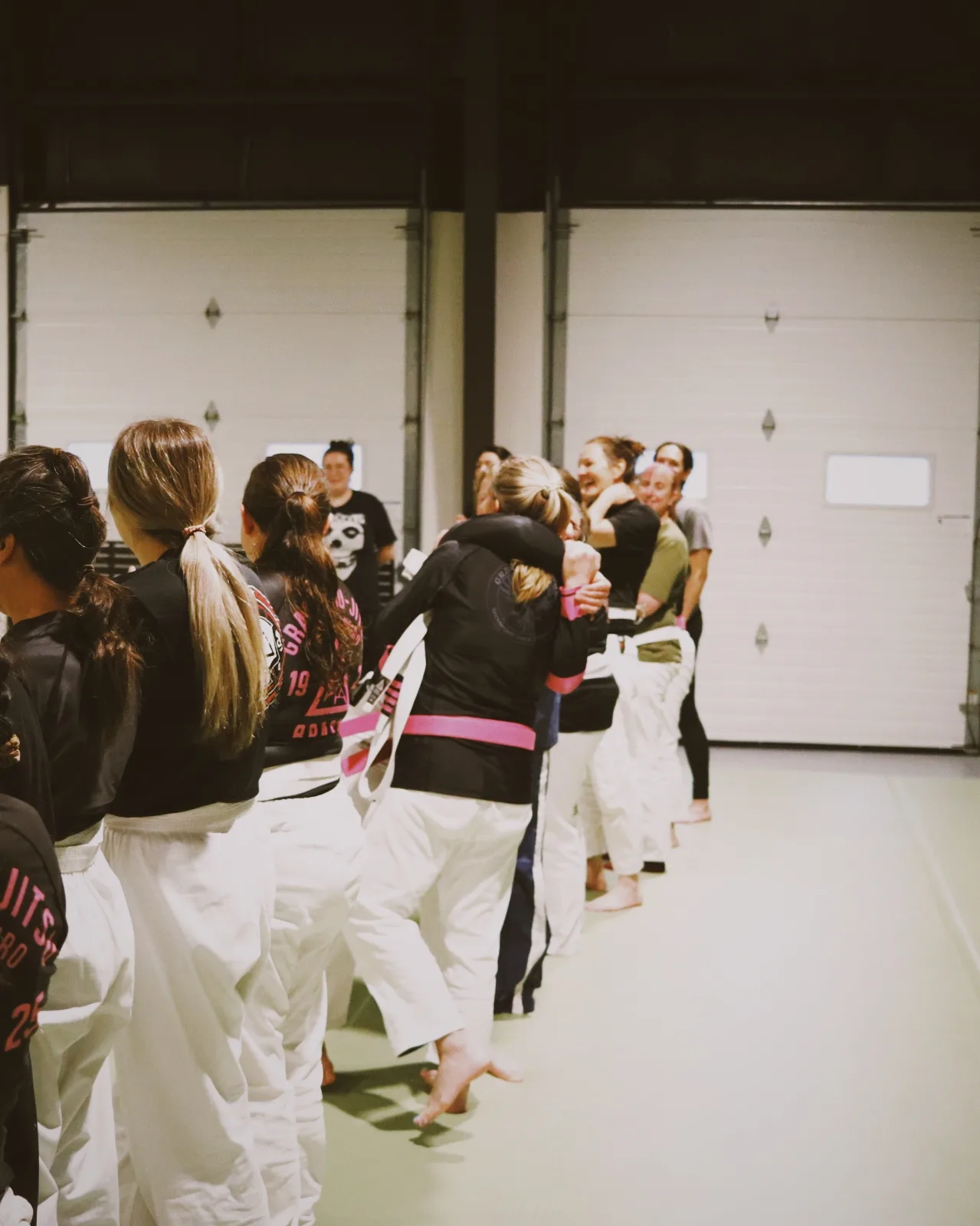 Students greeting each other at the end of a Women Empowered class.
